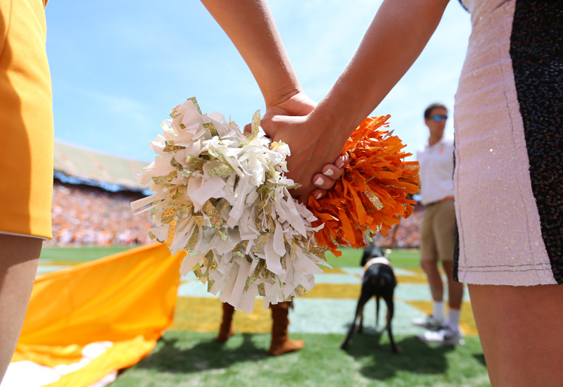 Cheerleader holding pompom